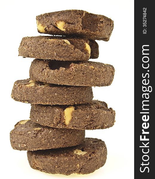 Zigzag tower stack of peanut vegetarian cookies on white background. Zigzag tower stack of peanut vegetarian cookies on white background