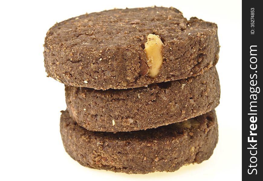 Stack of three peanut vegetarian cookies on white background. Stack of three peanut vegetarian cookies on white background