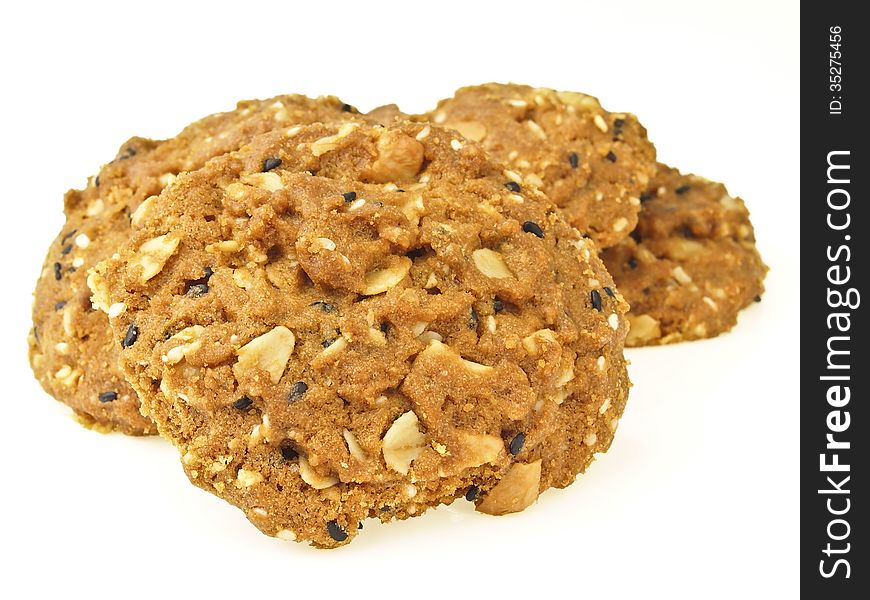 Closeup of pile delicious whole grains cookies on white background. Closeup of pile delicious whole grains cookies on white background