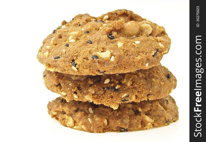 Triple stack of whole grains cookies on white background. Triple stack of whole grains cookies on white background