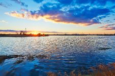 The Pumping Unit And Lake In The Afterglow Stock Images The Pumping Unit And Lake In The Afterglow Stock Images