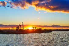 The Oil Fields And Lake In The Afterglow Royalty Free Stock Photos The Oil Fields And Lake In The Afterglow Royalty Free Stock Photos