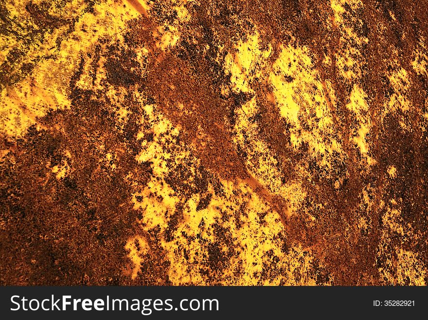 Rusty metal texture for background in orange and yellow
