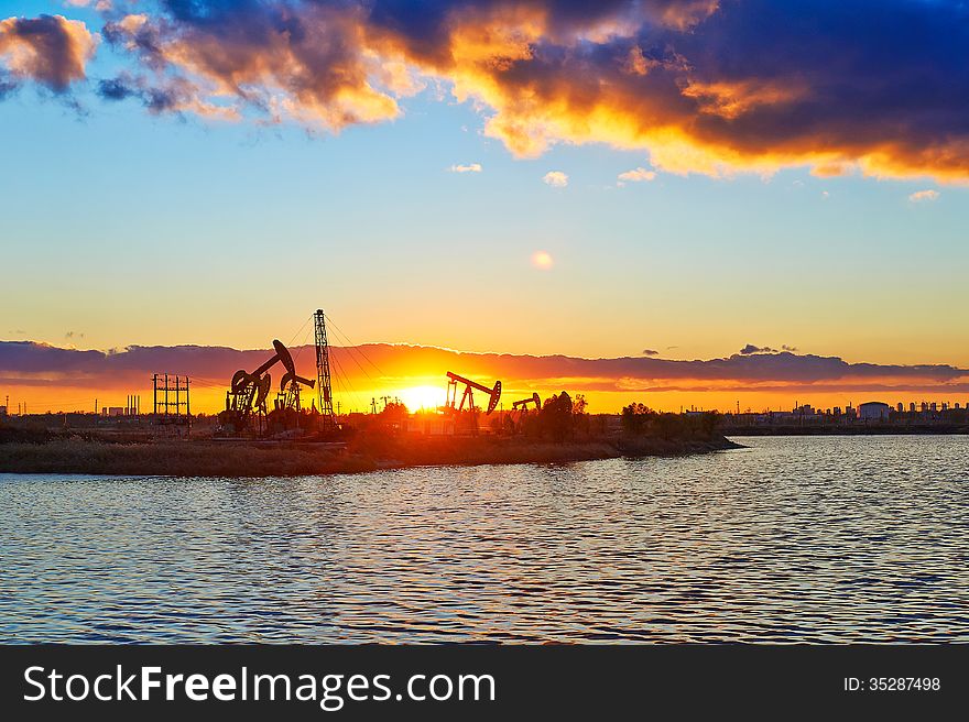 The Oil Fields And Lake In The Afterglow