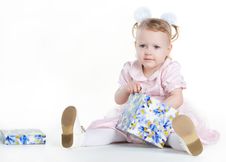 Little Girl Opening The Present Royalty Free Stock Photography