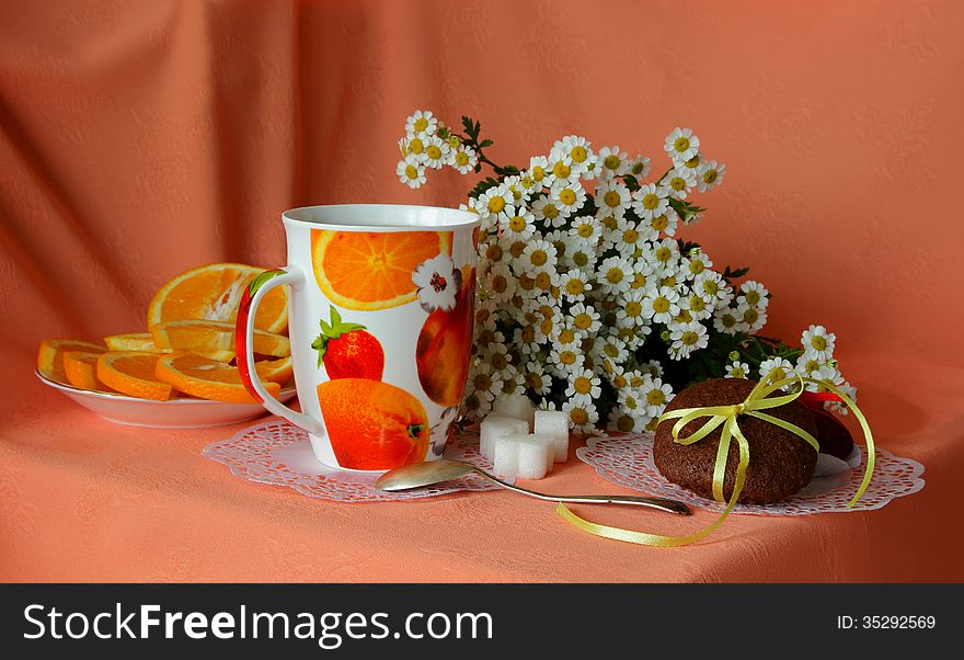 Chocolate cake,  a cup of coffee and bouquet of daisies