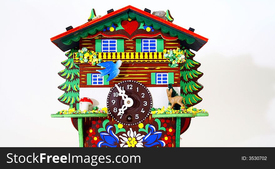 Toy house with bright colors and a clock