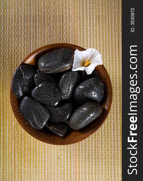 Spa products with stones in a bowl