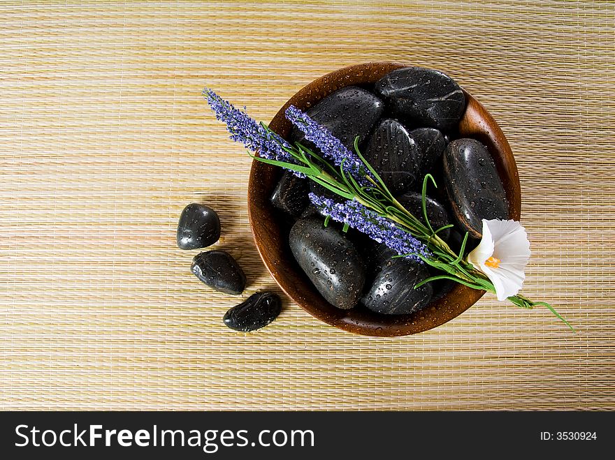 Bowl of hot stones for lastone massage. Bowl of hot stones for lastone massage