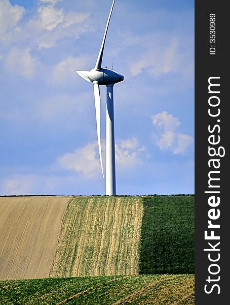 Windmill on the horizon with fields. Windmill on the horizon with fields