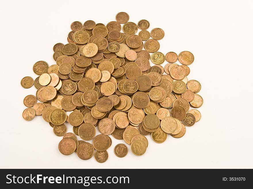 A pile of yellow coins against white background. A pile of yellow coins against white background.