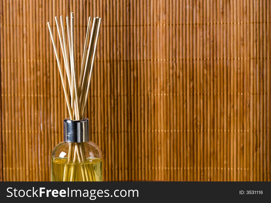 Aroma sticks dipped in scented oils on bamboo background. Aroma sticks dipped in scented oils on bamboo background