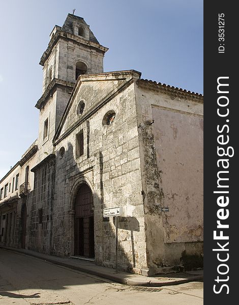 Old church of the Sacred Spirit in the historical part of the city of Havana, built in the time in that Cuba was Spanish colony. In the picture they can be observed, the steeple, the main door and the stone walls.