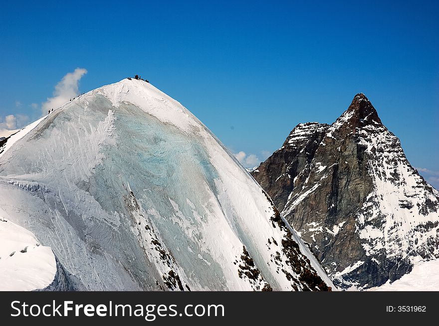 Breithorn peak, on background the Matterhorn, west alps, Europe.