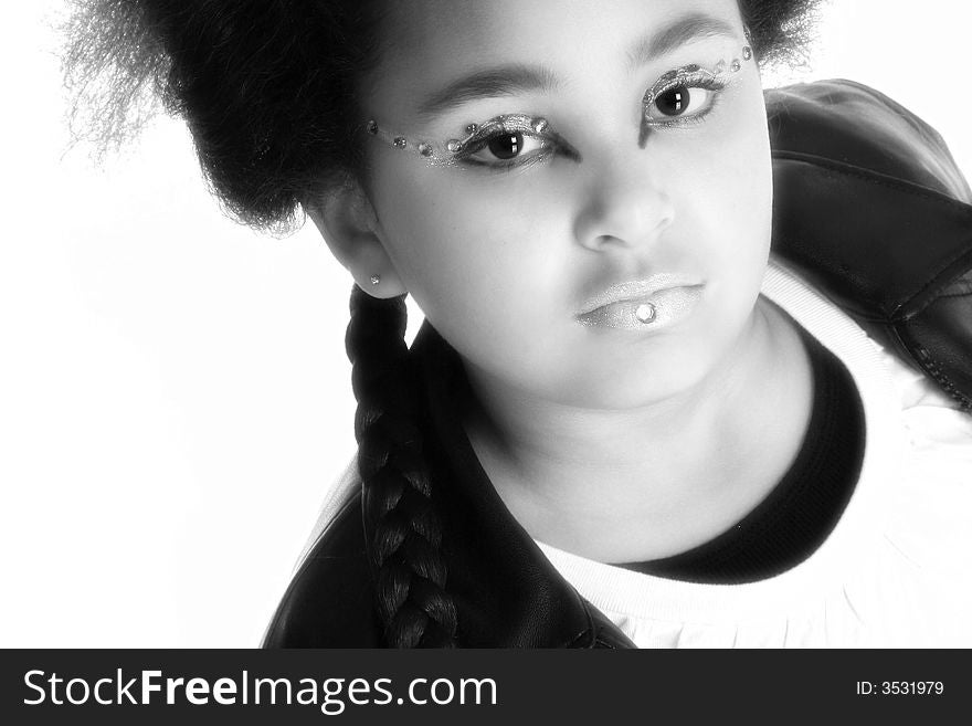 Beautiful ten year old African American girl with artistic cosmetics.  black and white. Beautiful ten year old African American girl with artistic cosmetics.  black and white