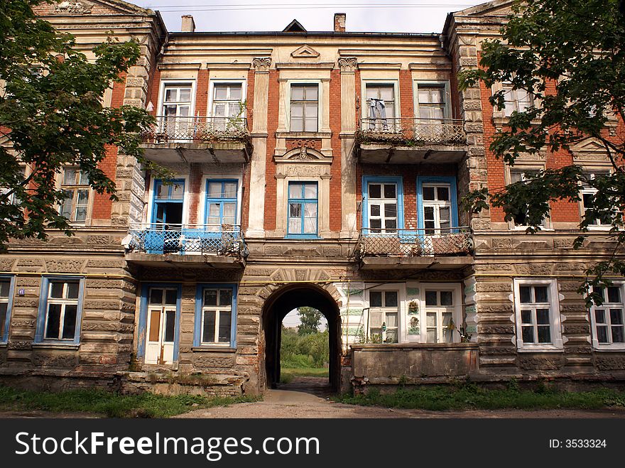 Old rusty building on the street of Gusev, Kaliningrad region, Russia. Old rusty building on the street of Gusev, Kaliningrad region, Russia