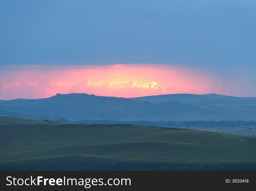 Sunset over mountain. Nature background.