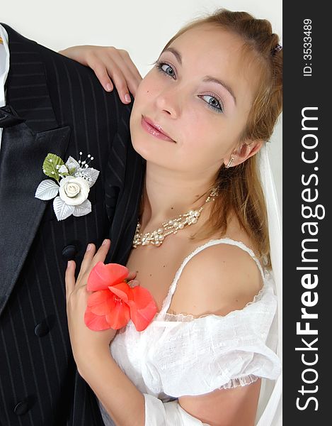 Girl with flower on shoulder of her bridegroom. Girl with flower on shoulder of her bridegroom