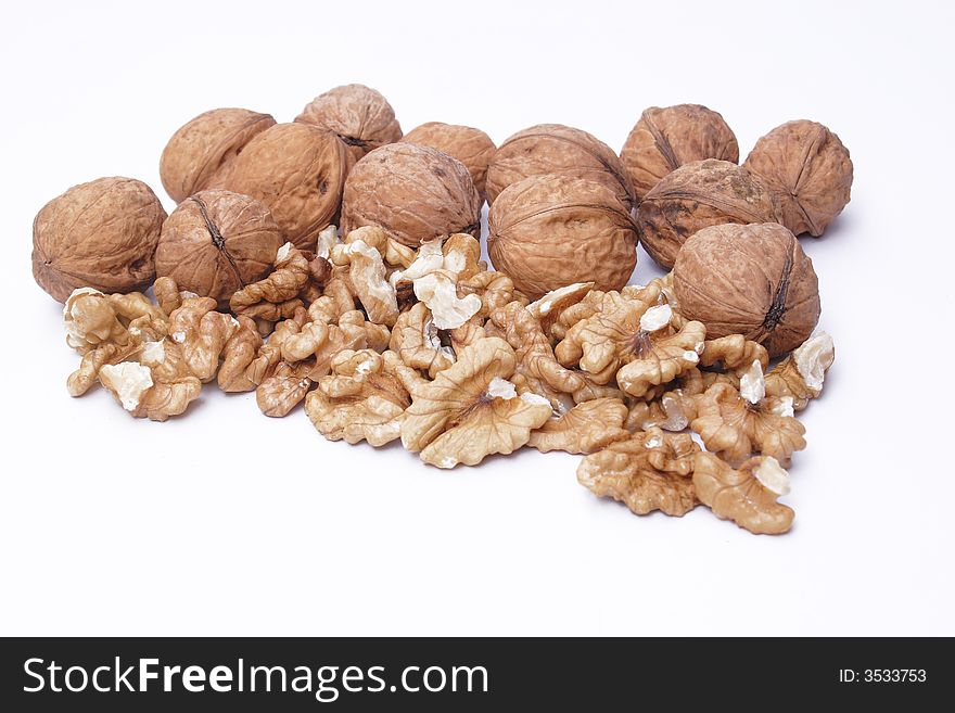 Golden walnuts, hazel on the white background