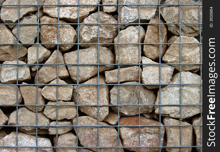 Limestone gabian wall, showing steel mesh grid