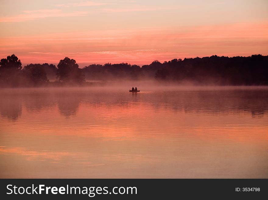 Morning angler on the lake