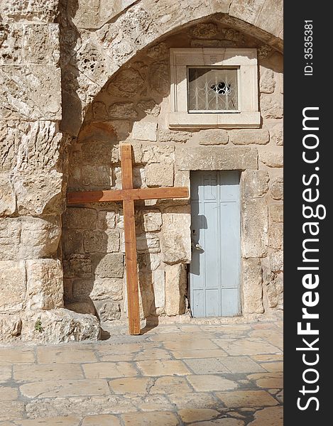 Cross at a wall of a temple