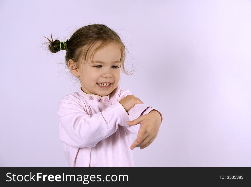 Little girl dancing on the white background
