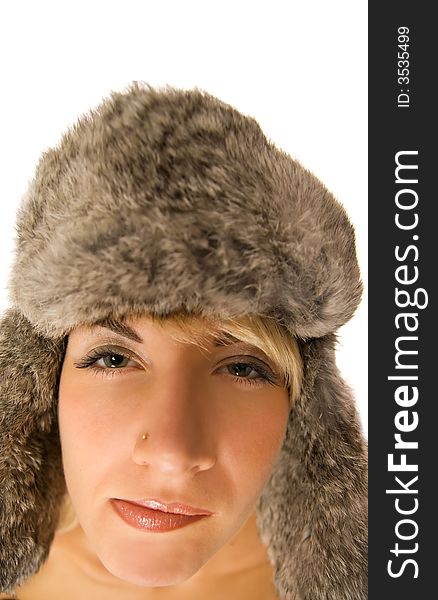 Funny girl in fur-cap isolated on white background