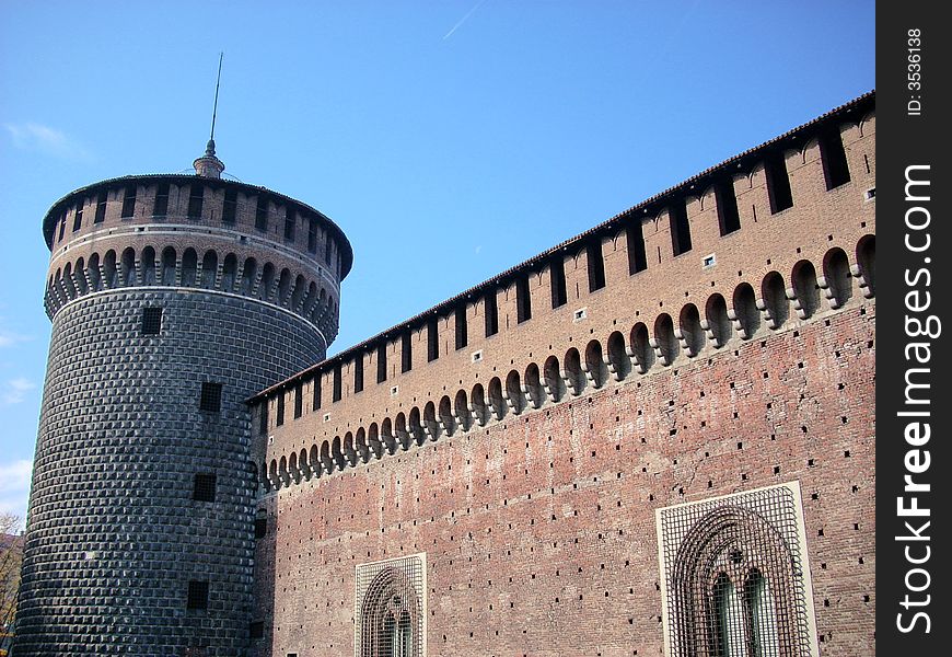 A part of the castle sforzesco in Milan under a blue sky