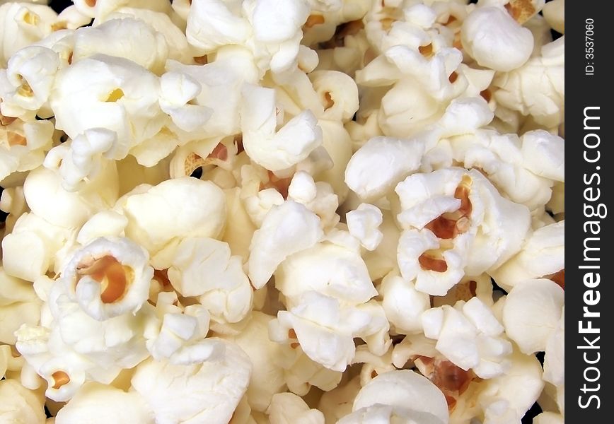 Full frame color photo of popped popcorn with no butter or salt added. Full frame color photo of popped popcorn with no butter or salt added.