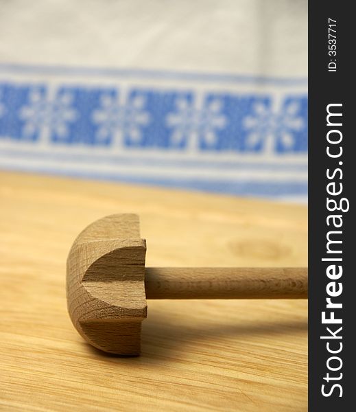 Wooden twirling-stick on wooden board
