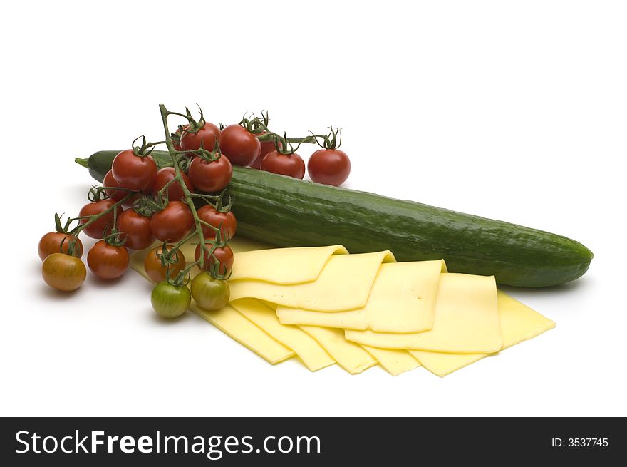 Cheese and tomatoes and cucumber on white background. Cheese and tomatoes and cucumber on white background