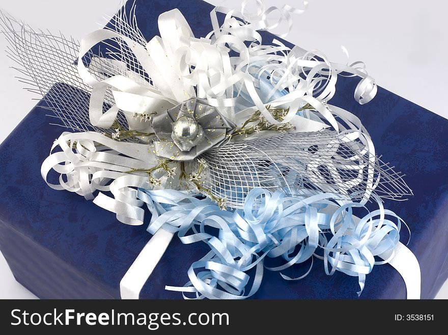 Blue gift box with  ribbon isolated on white