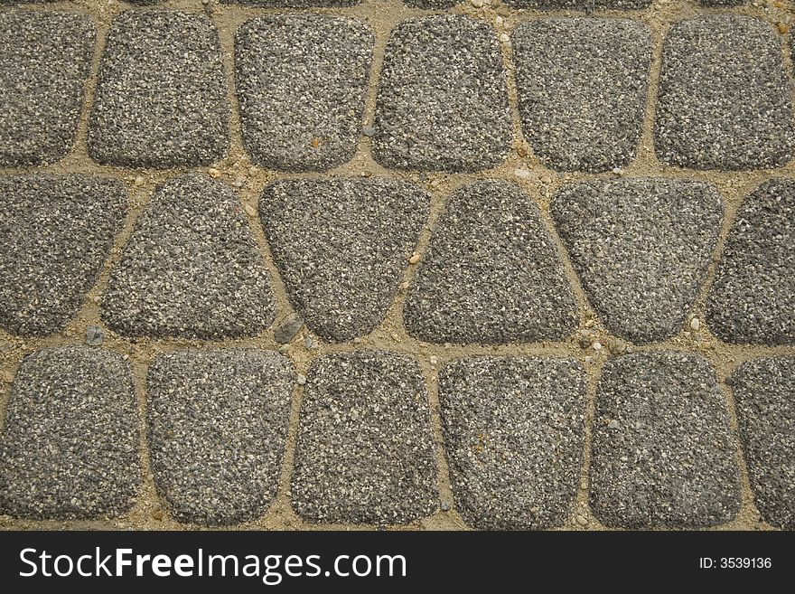 Texture of sidewalk ground of stones. Texture of sidewalk ground of stones