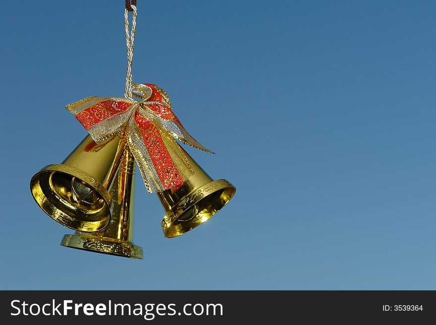 A picture of three christmas bells for the holiday