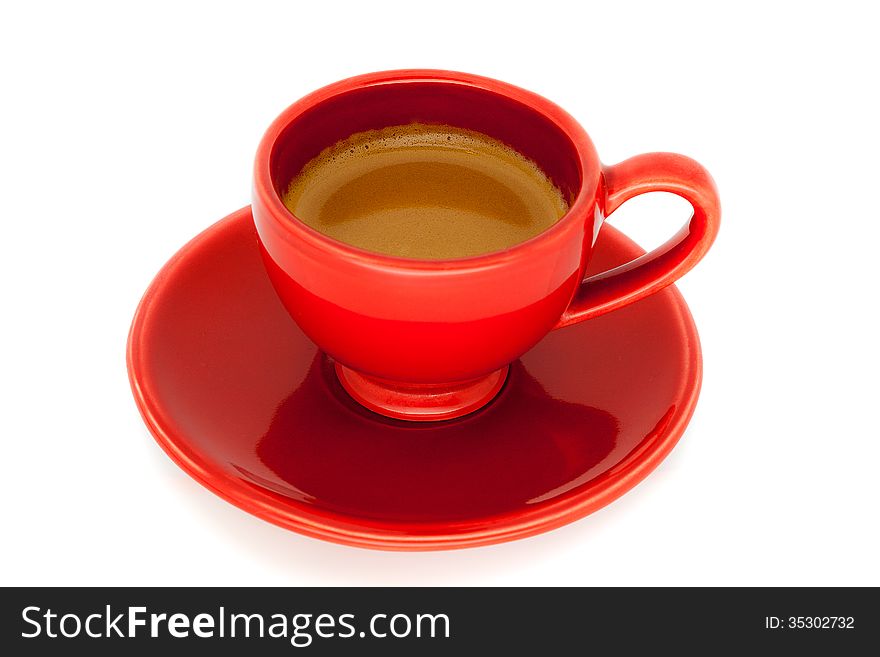 A cup of Italian espresso. Cup and saucer with red color inside the coffee ready to drink.