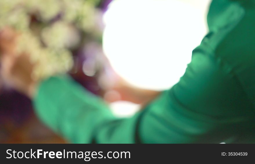 Woman florist arranging flower bouquet