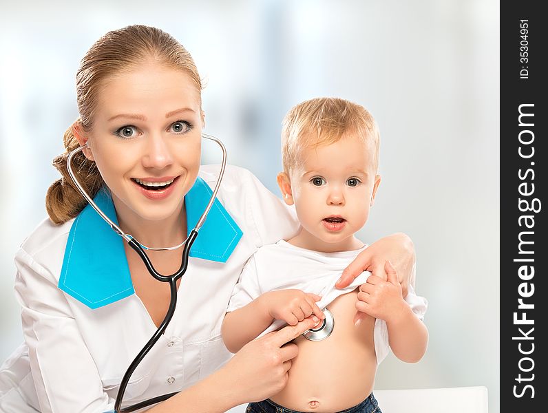 Baby And Doctor Pediatrician. Doctor Listens To The Heart With S