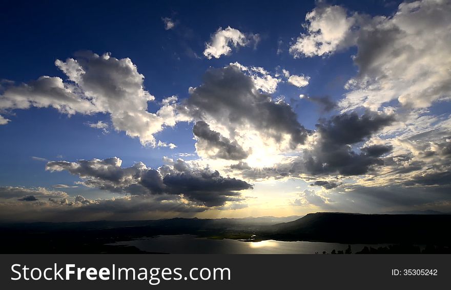 Cloudscape sun burst ray timelapse