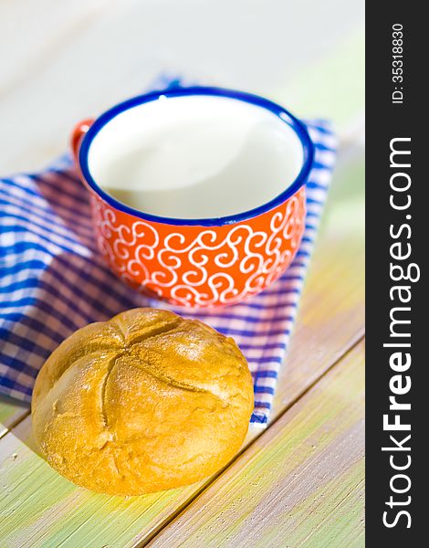 Cup Of Milk And Bread On Napkin