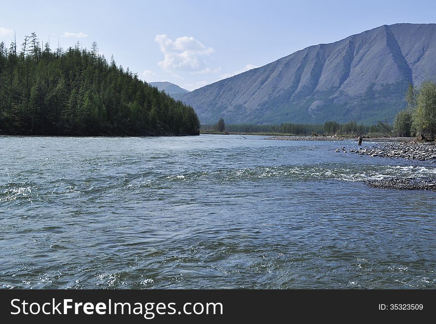 Pebble Bank of a mountain river. Russia, Yakutia, A Ridge Of Suntar-Khayata.