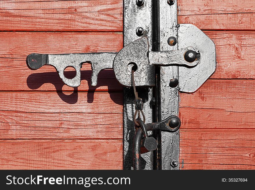 Closeup of a vintage wooden latch on a building