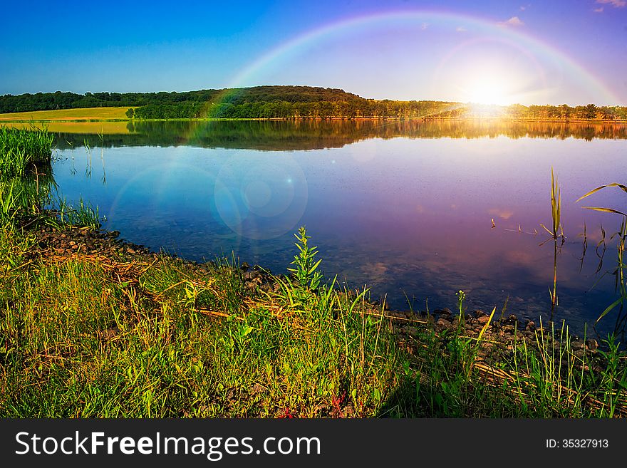 Morning mountain lake and forest on the embankment. Morning mountain lake and forest on the embankment