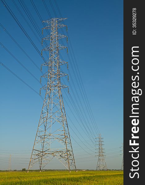 High voltage tower with blue sky background