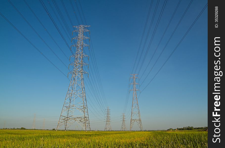 High voltage tower with blue sky background