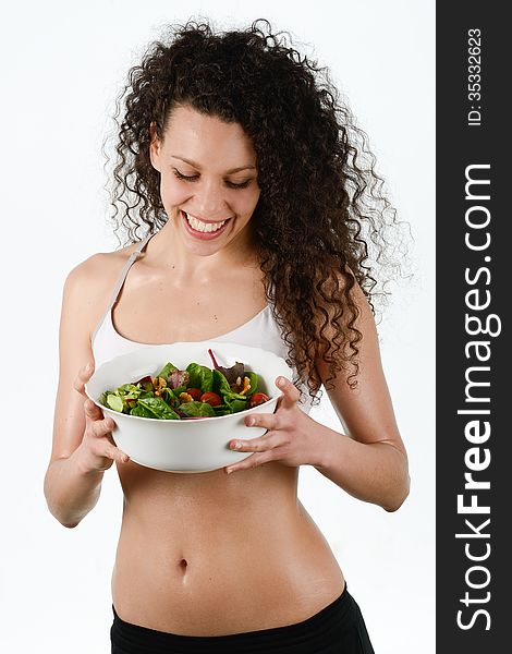 Beautiful young mixed woman with salad, isolated on white