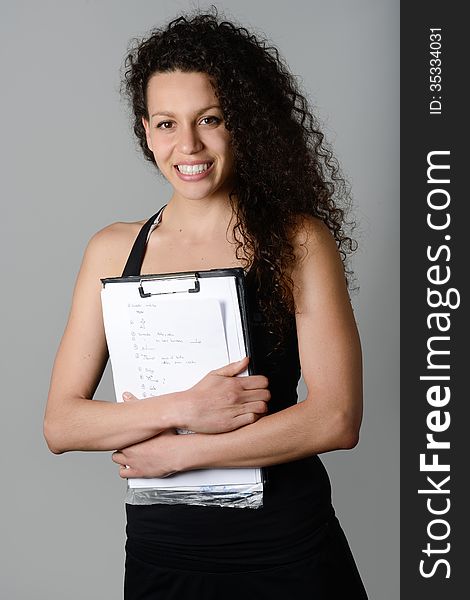 Young cheerful smiling woman in sports wear