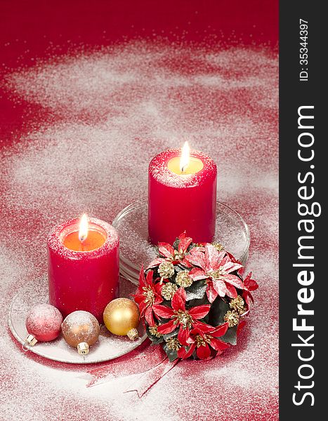 Christmas decoration with candles ribbons and cookies
