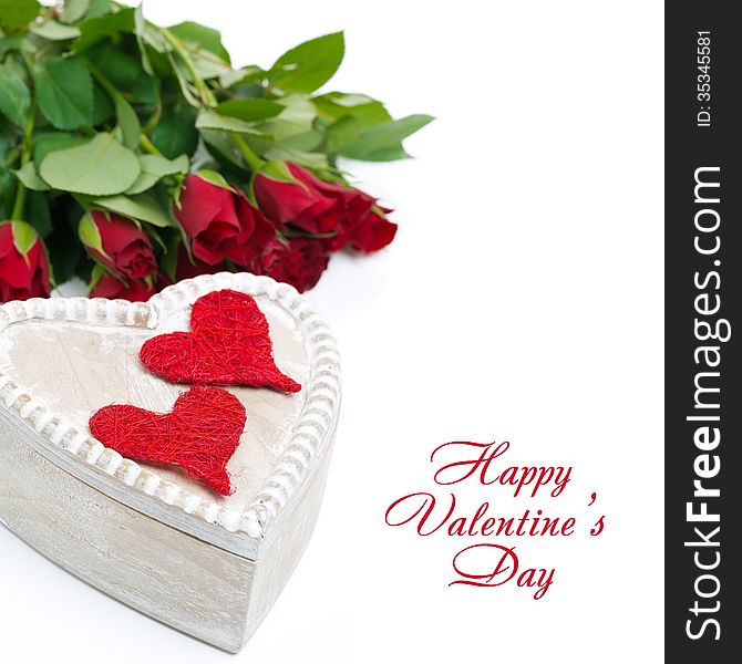 Wooden box with red hearts and roses, isolated on white