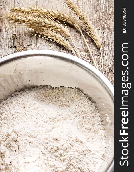 Mixing wheat flour in metallic bowl. See my other works in portfolio.